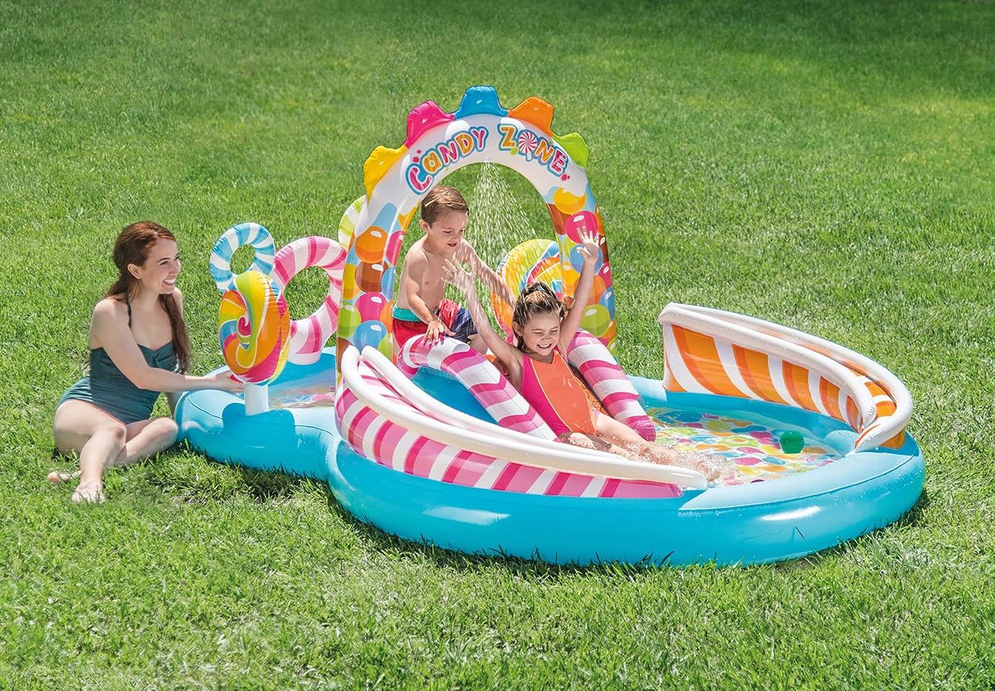 Candy Zone Inflatable Kiddie Pool: Inflatable Kids Pool with Water Sprayer and Slide – Splash Pad – 116 x 75 x 51 – Ages 3+
